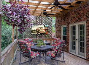 Luxury outdoor living space with integrated TV installation