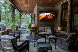 Covered veranda outdoor TV installation with clean mounting