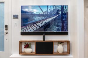 Professional wall-mounted TV installation with clean cable management